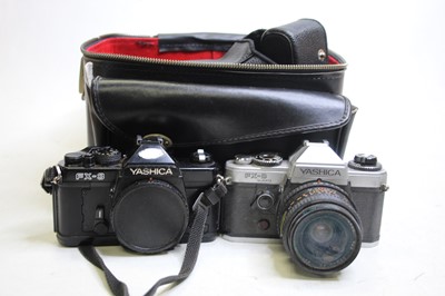 Lot 326 - A Yashica FX-D quartz SLR camera, together...