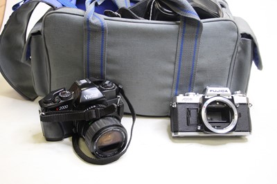 Lot 327 - Four vintage SLR cameras, to include a Vivitar...