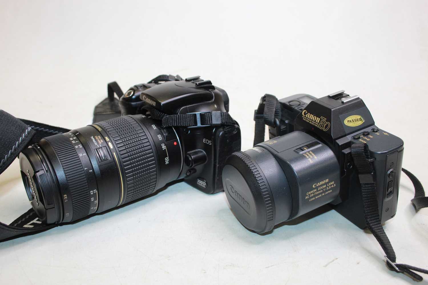 Lot 332 - A Canon EOS 300D digital camera, having Tamron...