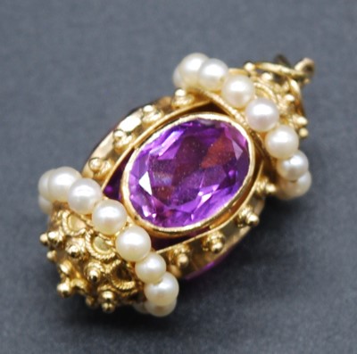 Lot 2711 - A yellow metal, amethyst and pearl cylindrical...