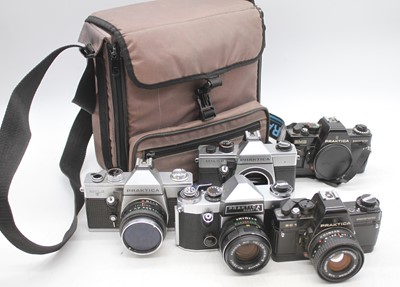 Lot 335 - A Praktica super TL SLR camera, with five...
