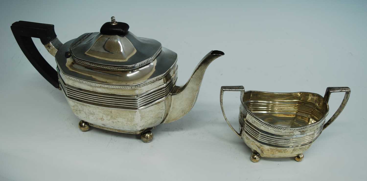 Lot 2160 - An Edwardian silver teapot and sugar duo, each...