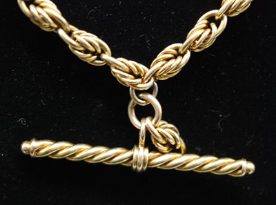 Lot 2667 - A yellow metal rope link double watch chain...
