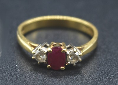 Lot 2691 - An 18ct gold, ruby and diamond three-stone...