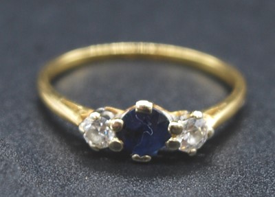 Lot 2717 - An 18ct gold, sapphire and diamond three-stone...