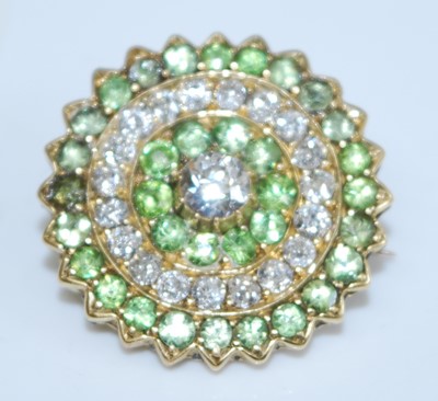 Lot 2732 - A yellow metal, peridot and diamond circular...