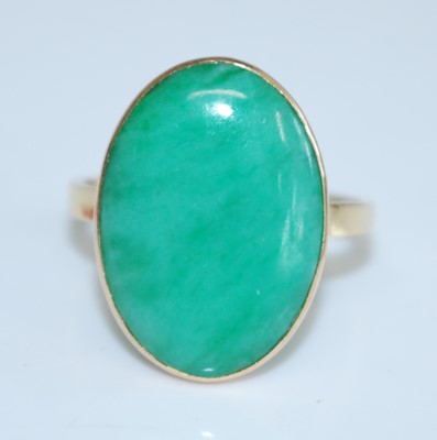 Lot 2740 - An 18ct yellow gold jadeite dress ring,...