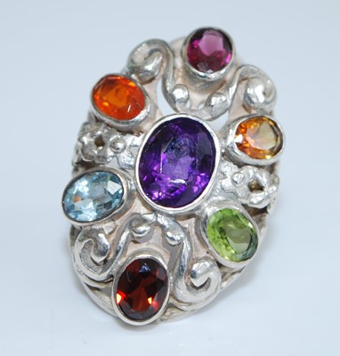 Lot 401 - A sterling silver multi-stone dress ring,...