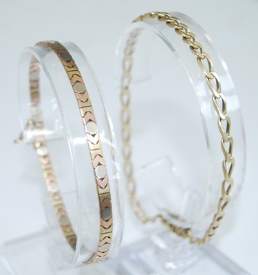 Lot 2750 - A modern yellow metal flat curblink bracelet,...