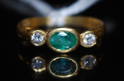 Lot 2756 - A contemporary 18ct gold, emerald and diamond...