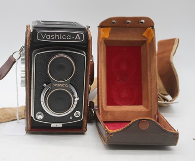 Lot 372 - A Yashica A TLR camera, with tan leather...