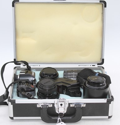 Lot 373 - A Minolta AF 5000 SLR camera, together with a...