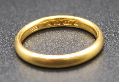 Lot 2773 - A 22ct gold wedding band, sponsor E&G,...