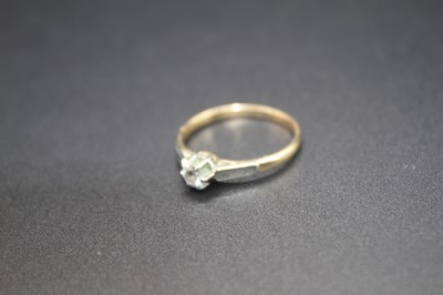 Lot 443 - A 9ct gold and platinum diamond solitaire ring,...