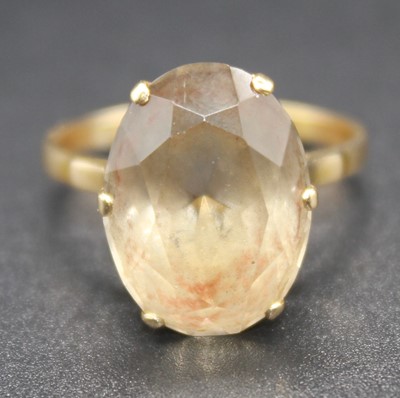 Lot 2777 - A 14ct gold smoky topaz set dress ring, the...