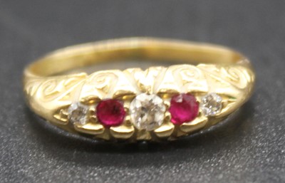 Lot 2787 - An 18ct gold ruby and diamond five stone ring,...