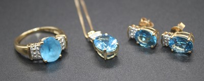 Lot 2798 - A modern yellow metal blue zircon and diamond...