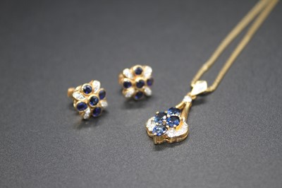 Lot 2831 - A modern far eastern yellow metal sapphire and...