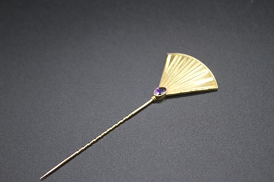 Lot 2833 - A fine 18ct gold and amethyst set tie pin by...