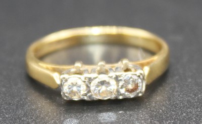 Lot 2822 - An Art Deco 18ct gold diamond three stone ring,...