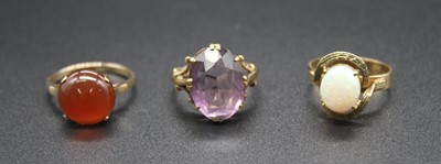 Lot 2840 - A 9ct gold oval cut amethyst set dress ring,...