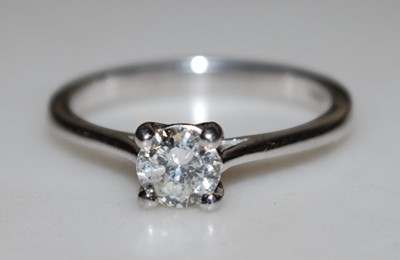 Lot 2809 - An 18ct white gold diamond single stone ring...