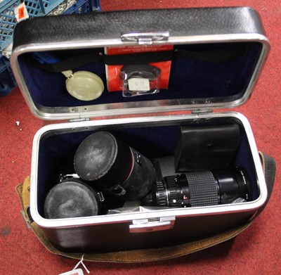 Lot 388 - A collection of camera lenses and accessories,...