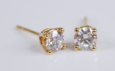 Lot 2206 - A pair of yellow metal diamond single stone...