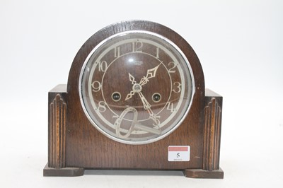 Lot 5 - A 1950s Smiths oak cased mantel clock having...