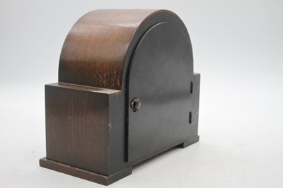 Lot 5 - A 1950s Smiths oak cased mantel clock having...