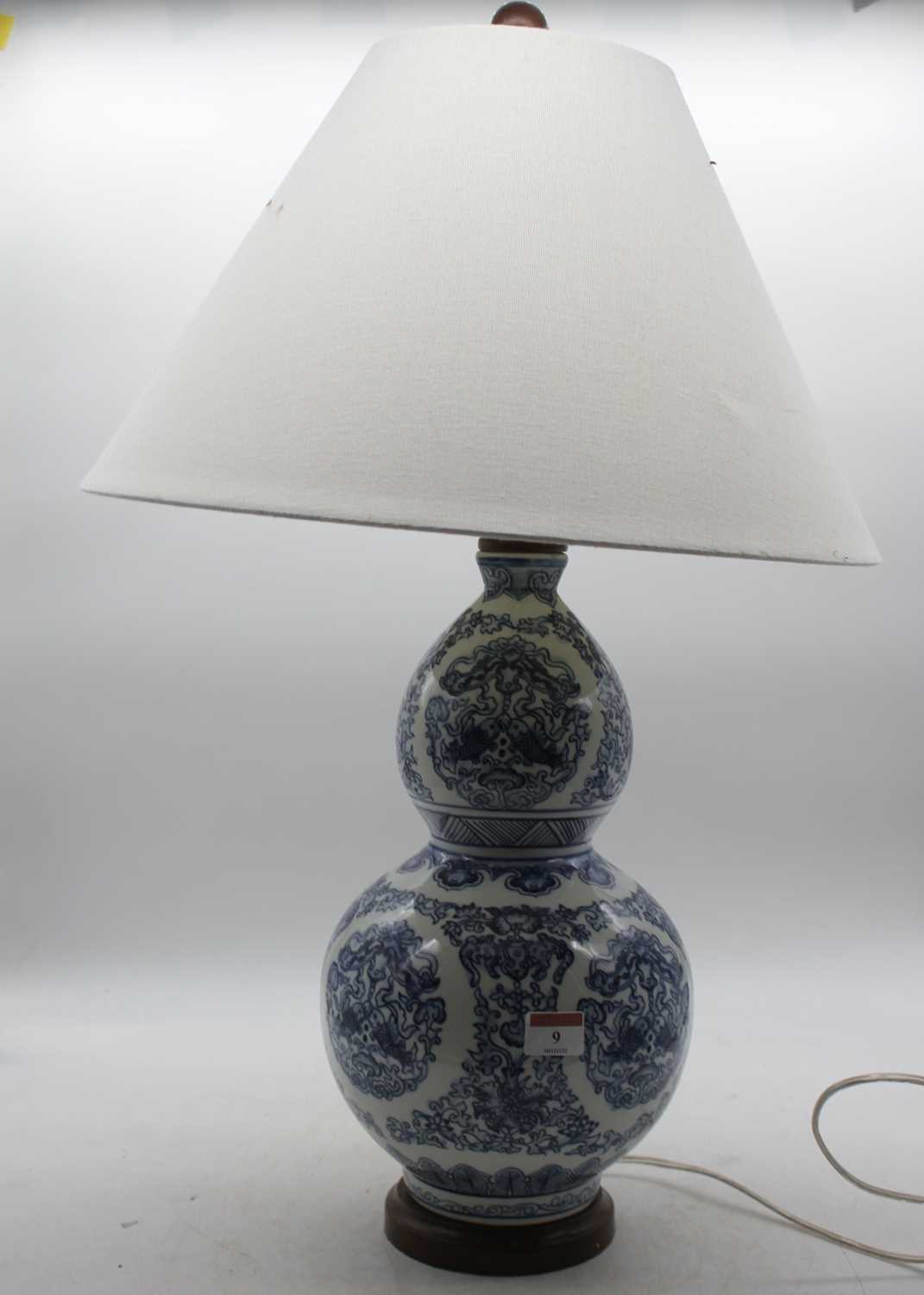 Lot 9 - A modern Chinese style blue & white table lamp...