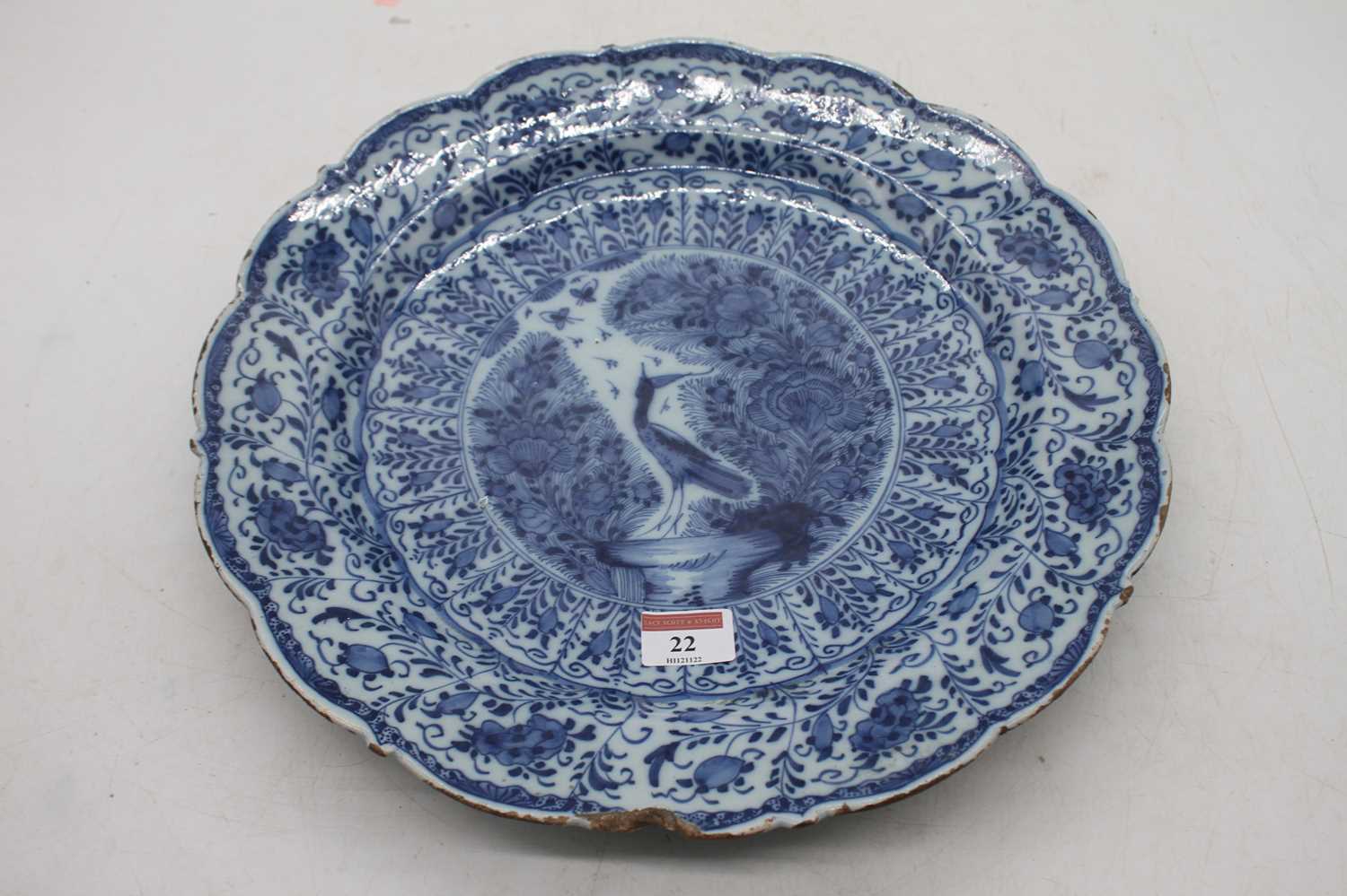 Lot 22 - An 18th century Dutch Delft bowl of scalloped...