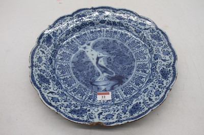 Lot 22 - An 18th century Dutch Delft bowl of scalloped...