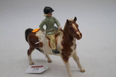 Lot 236 - A Beswick model of a girl on a pony, model...