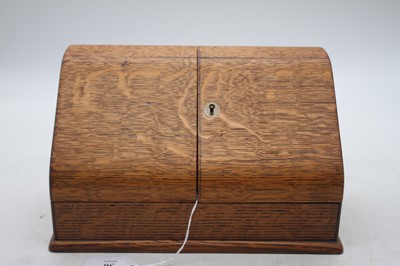 Lot 30 - An Edwardian oak table top stationery cabinet,...