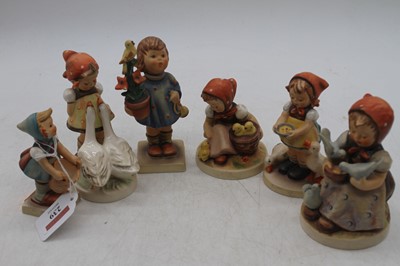Lot 239 - A collection of six Goebel figures of children,...