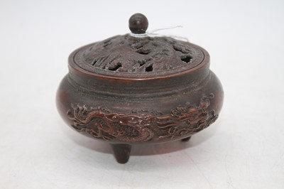 Lot 241 - A Chinese bronzed tripod censer, relief...