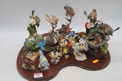 Lot 245 - A collection of models of birds, to include...