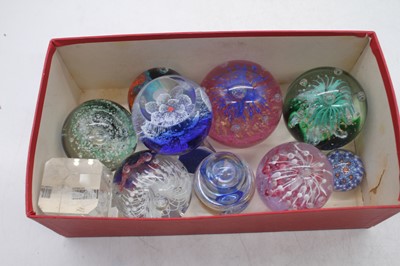 Lot 273 - A collection of glass paperweights, to include...