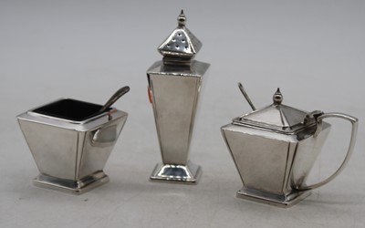 Lot 284 - An Art Deco three-piece silver plated table...