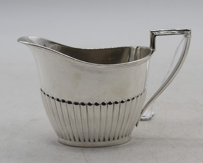 Lot 283 - An Edward VII silver milk jug, of...