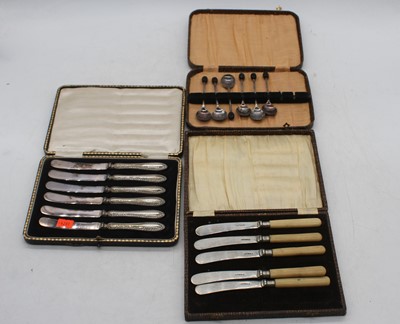 Lot 221 - A set of six silver handled butter knives;...