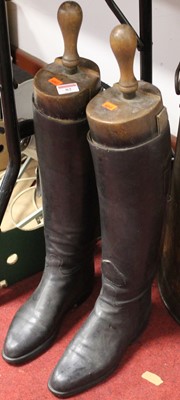 Lot 82 - A pair of black leather riding boots with trees
