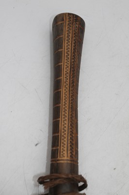 Lot 104 - A hardwood paddle, the shaped blade with...
