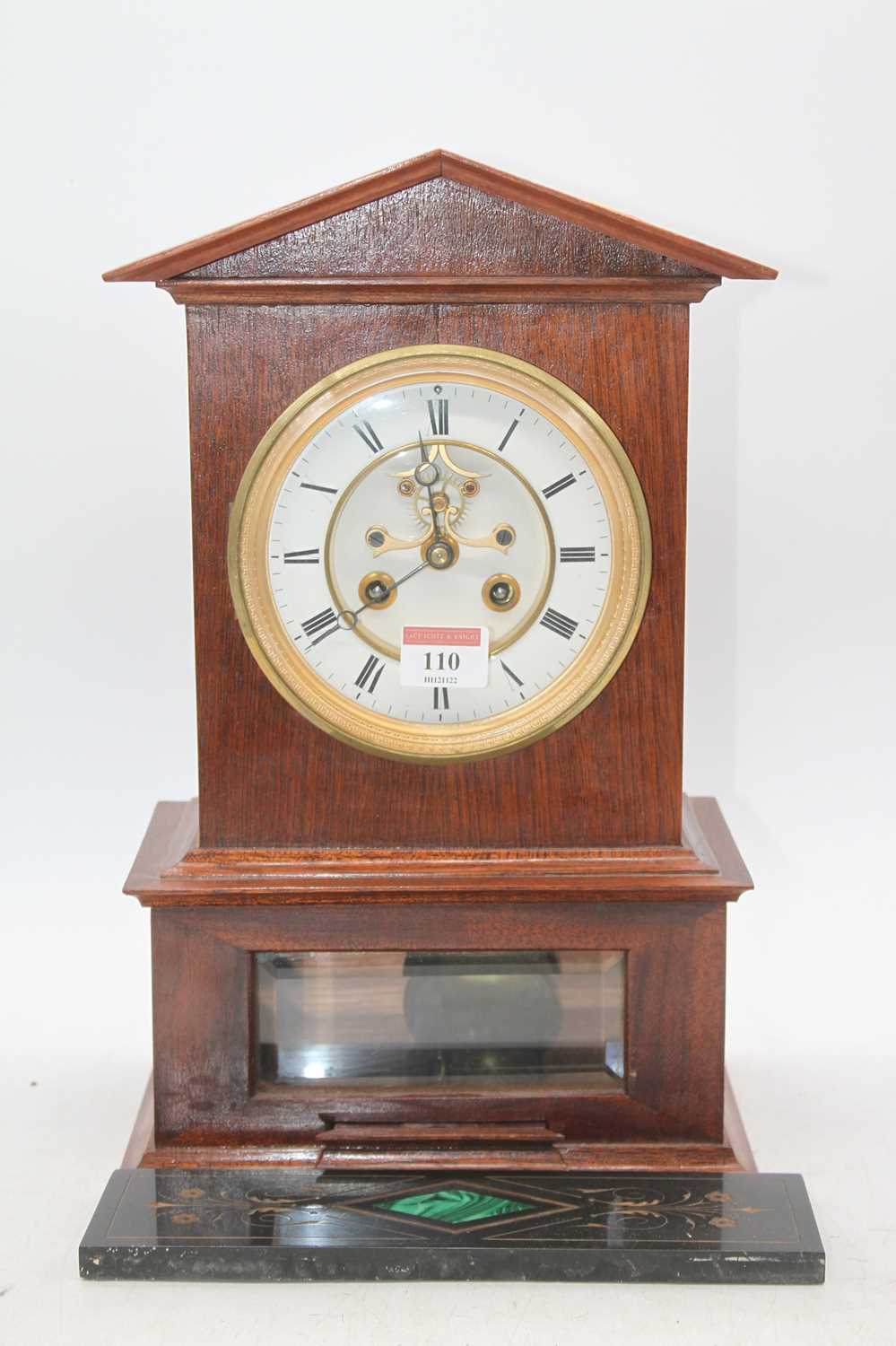 Lot 110 - A walnut cased mantel clock, having a circular...