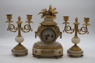 Lot 116 - A late 19th century French gilt metal and onyx...