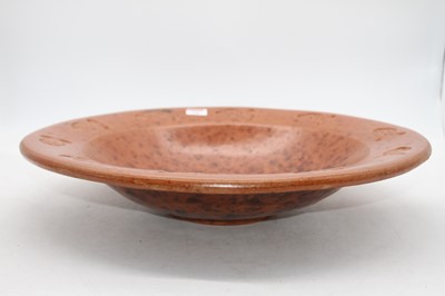 Lot 135 - A large simulated burr wood terracotta bowl,...
