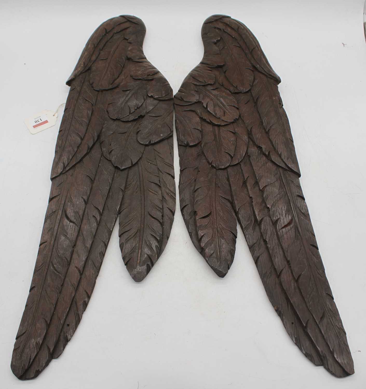 Lot 130 - A pair of 18th century oak panels, carved as a...