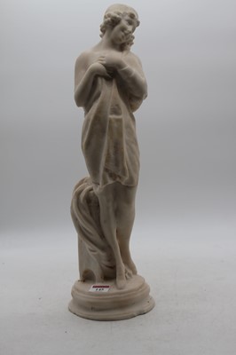 Lot 145 - A large alabaster figure carved as a semi nude...