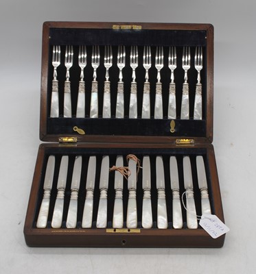 Lot 285a - A walnut cased set of twelve silver and mother...